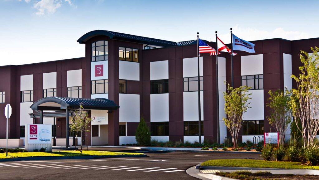 Exterior of Saft America Battery Manufacturing Facility|Interior of Saft America. White walls