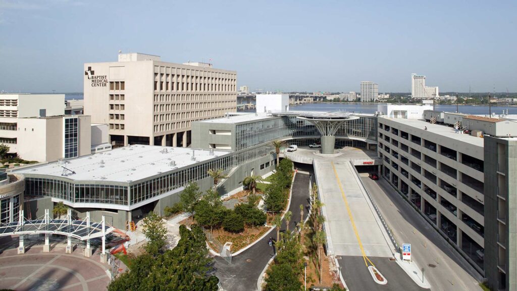 Exterior photo of Baptist Heart Hospital. Streets leading into entrance and parking garage.|