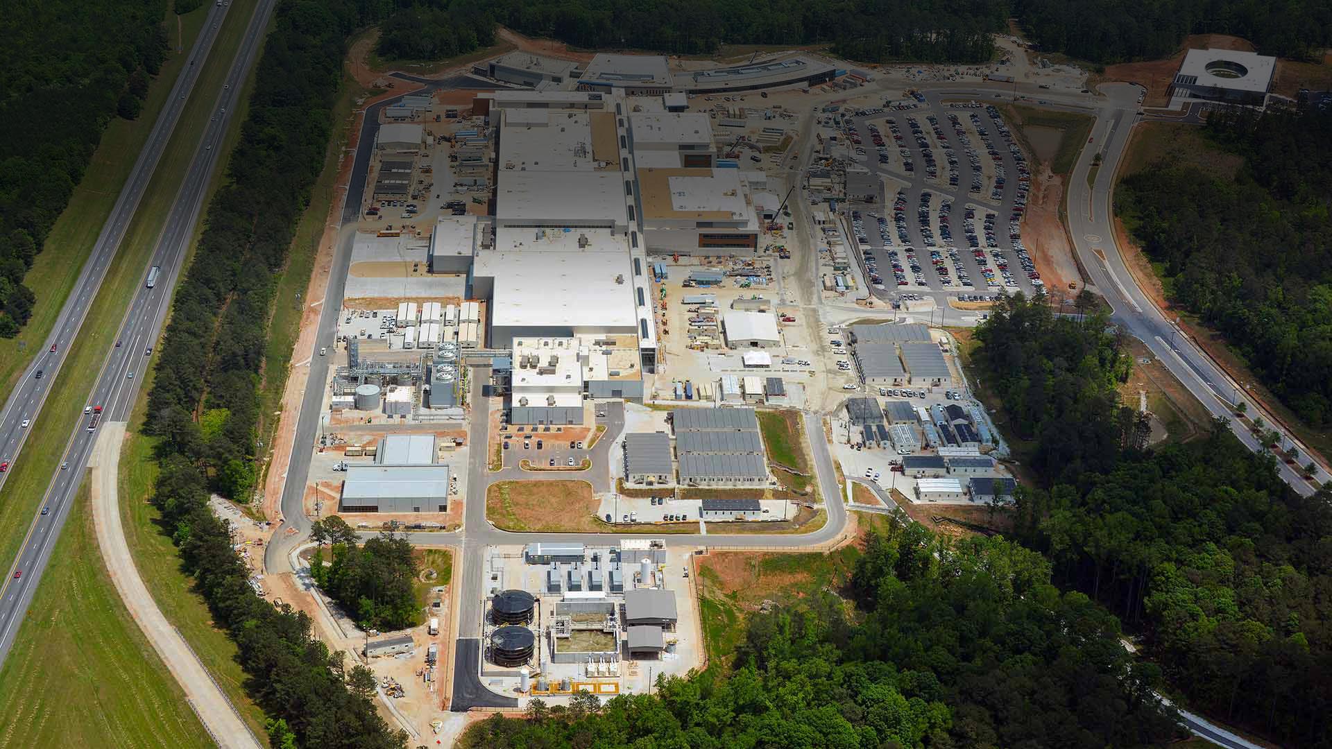 Aerial photo of Greenfield Biologics Facility|Exterior photo of Greenfield Biologics Facility process tanks and piping|Exterior photo of Greenfield Biologics Facility process tanks and piping|Exterior photo of Greenfield Biologics Facility process tanks and piping||||