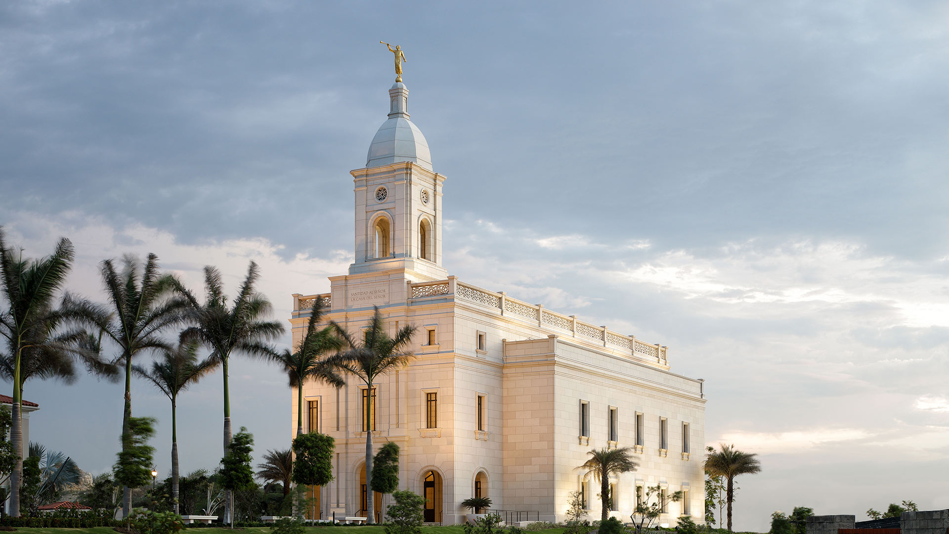 Exterior photo of the Church of Jesus Christ of Latter-Day Saints Temple. The three-story temple is constructed of concrete.