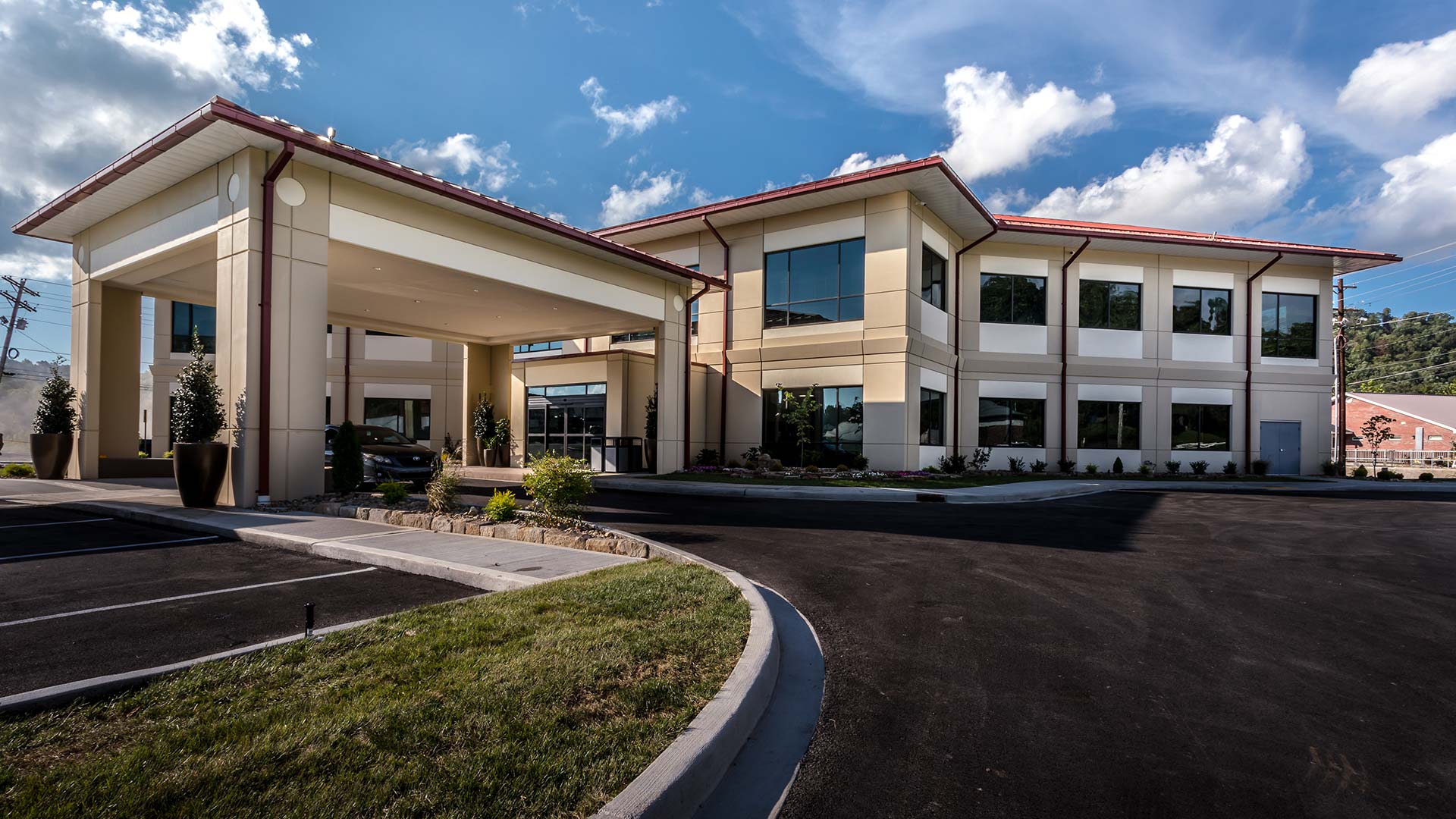 Exterior photo of main covered entrance to the 27