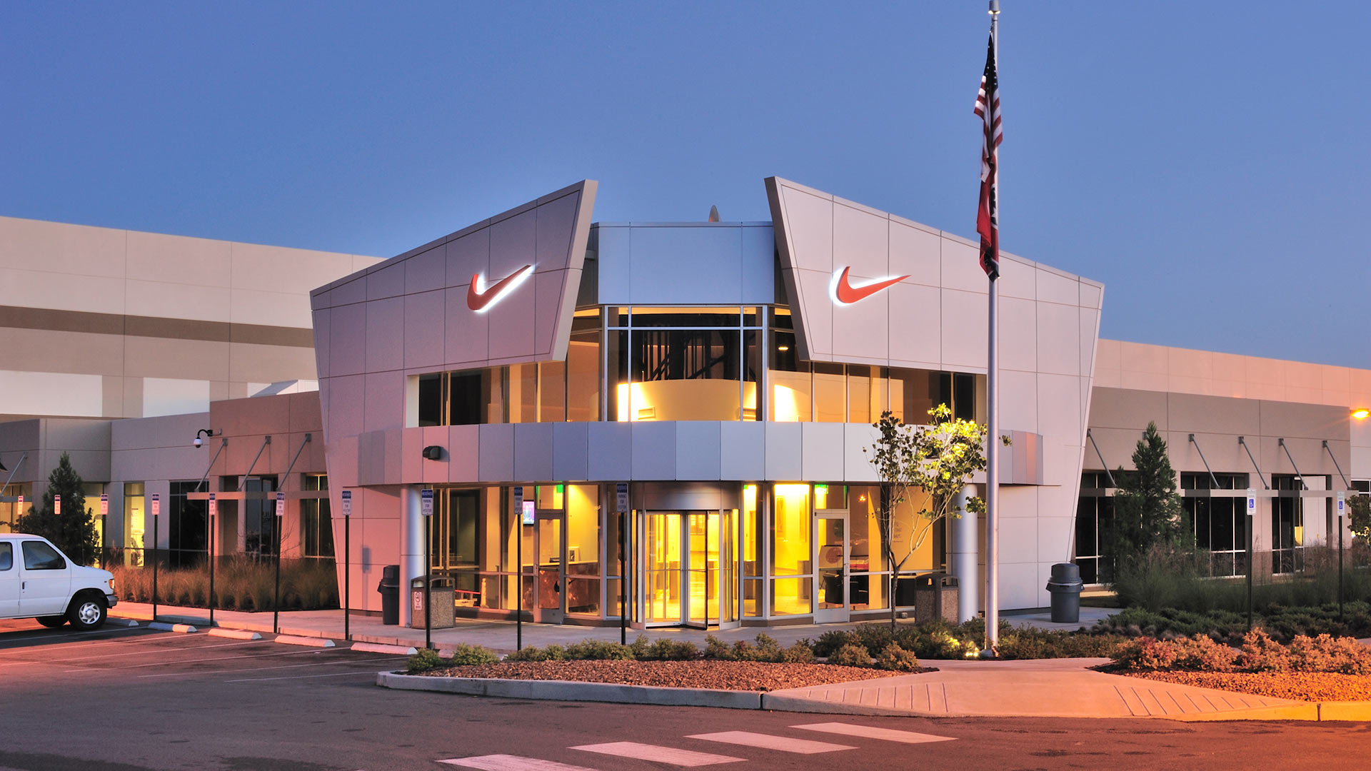 Exterior of Nike Distribution Center entry|Reception area of Nike Distribution Center|Interior operations area of Nike Distribution Center|Interior of Nike Distribution Center warehouse||||